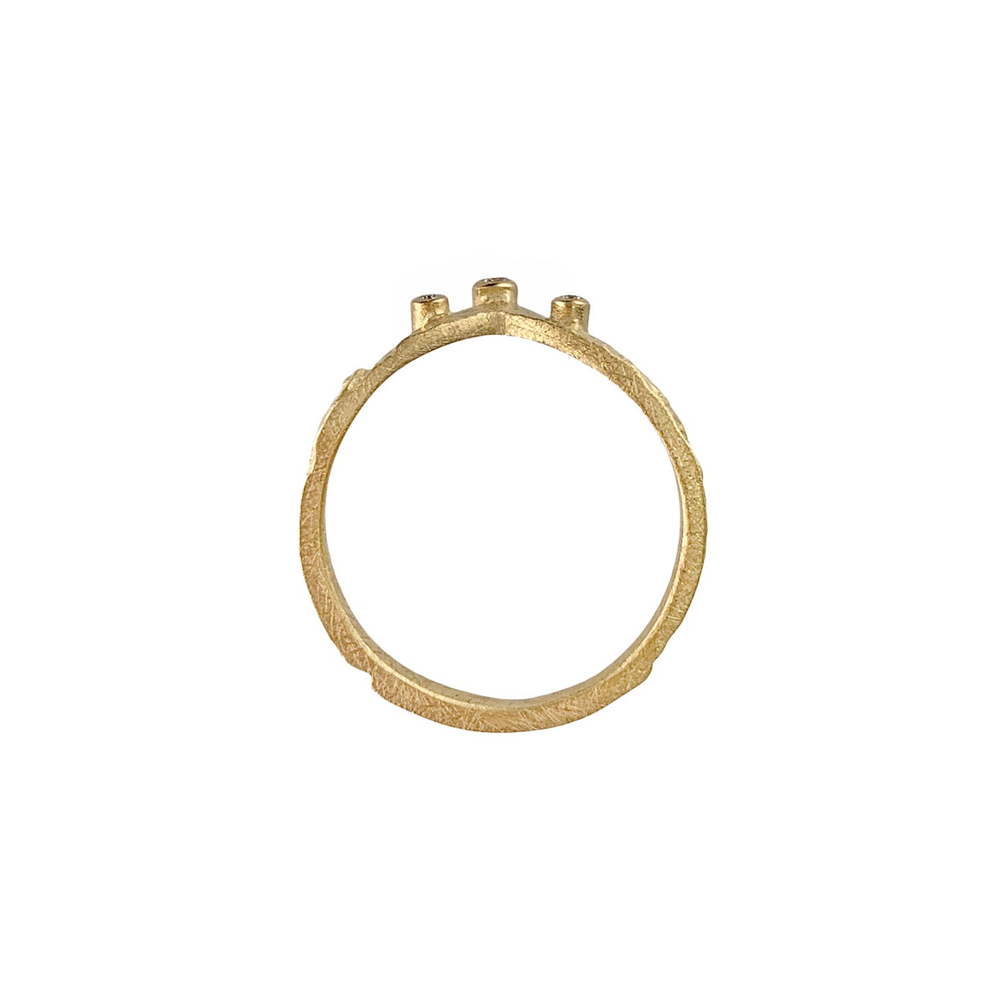 View of the ring as a circle. Pounded gold shows artisinal textural features. Gold wrapped sides on three diamonds are visible at the top of the circle.