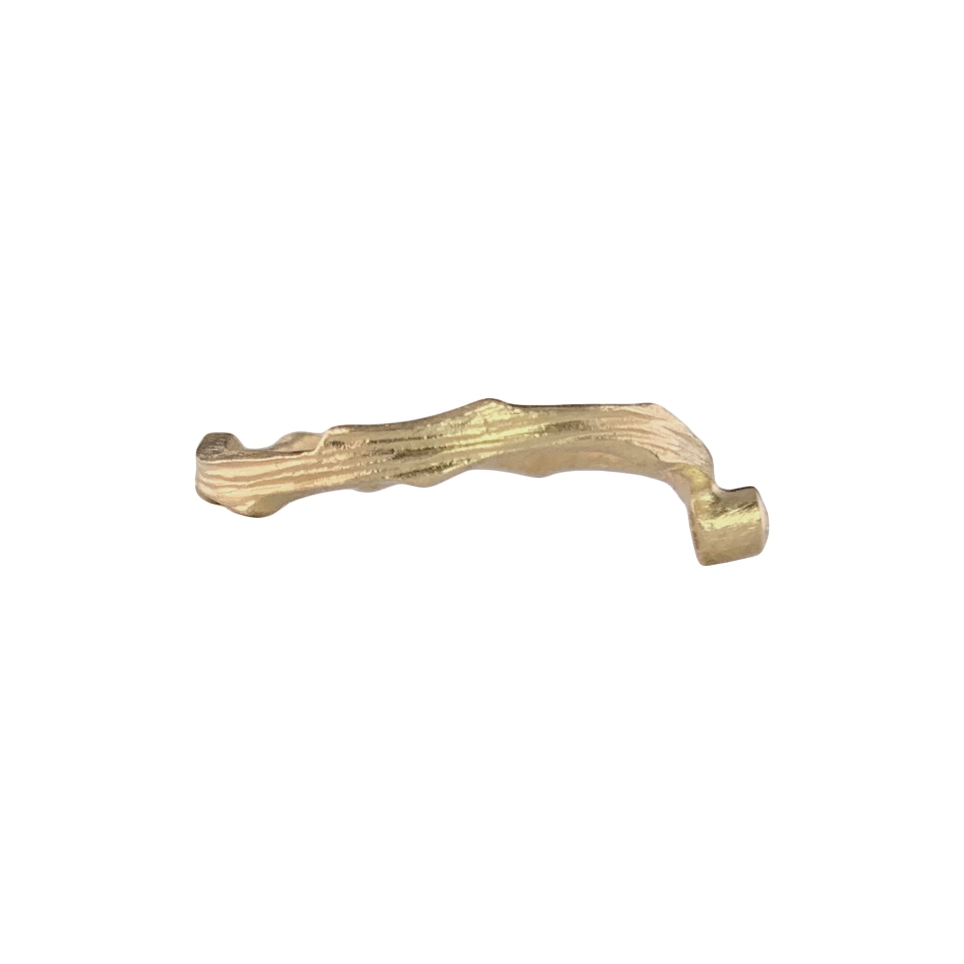 Side view of a gold ring with a wavy, textured band. On the right side is a gold wrap that holds a diamond.