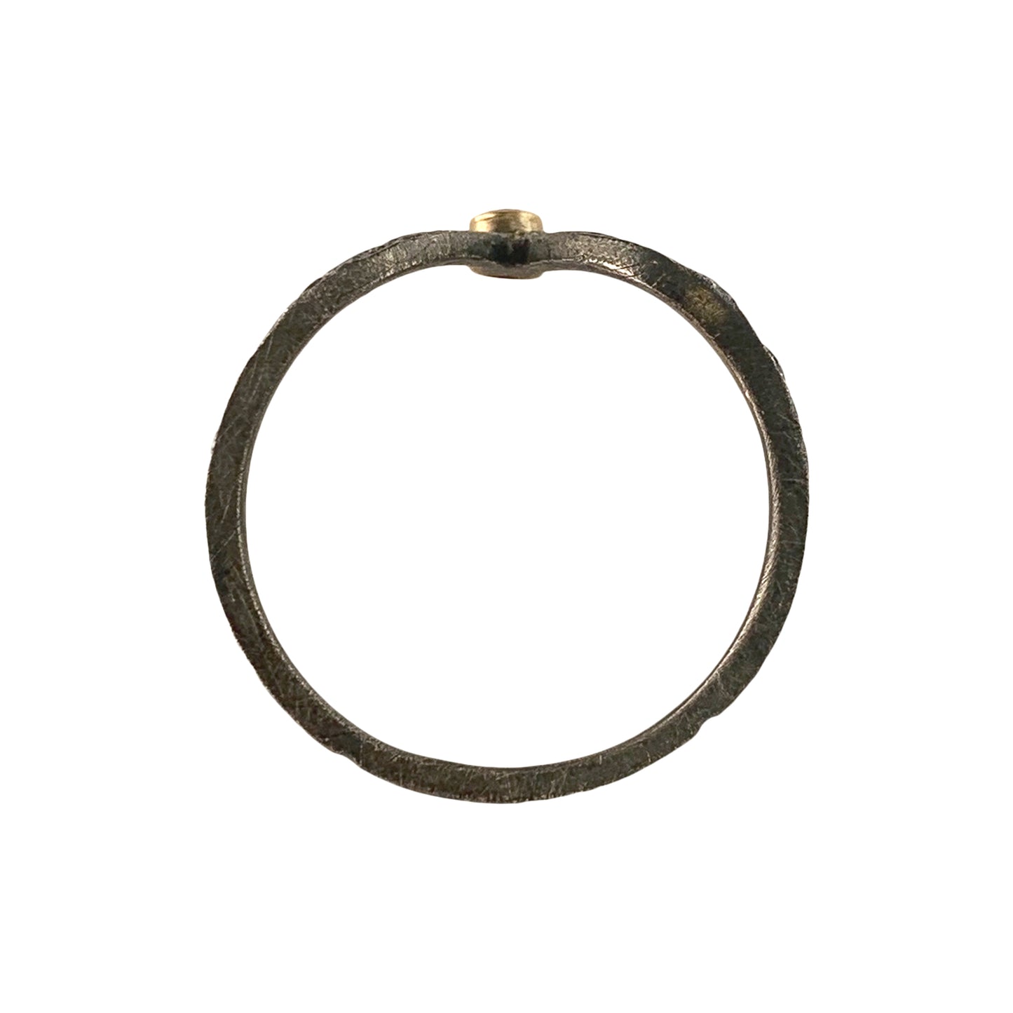Vertical view of a textured dark gray round band. At the top of the circle is smooth yellow gold, which holds a diamond (not visible).